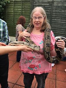 Picture of Annabel holding Quito the boa constrictor