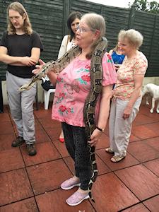 Picture of Annabel holding Quito the boa constrictor