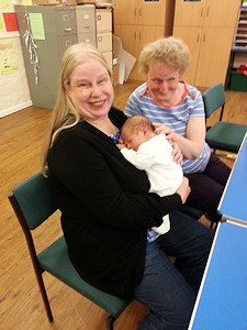 PPicture of Annabel and Anne giving Stanley a cuddle