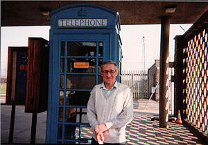 Picture of Deryck by a blue phone box